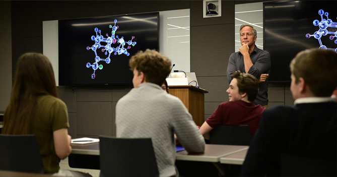 Mike Rowe in classroom with students