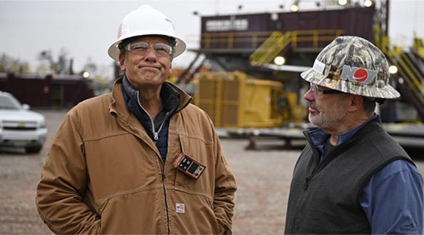 Mike Rowe with a technician