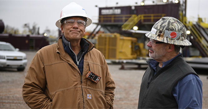 Mike Rowe with a technician