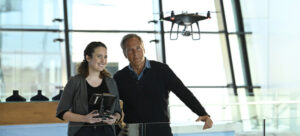 Mike Rowe with a drone operator