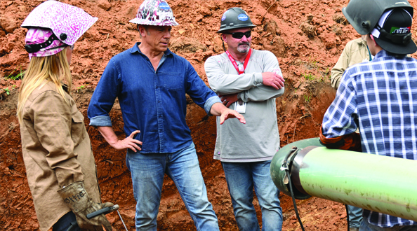 Mike Rowe talking with technicians in the field