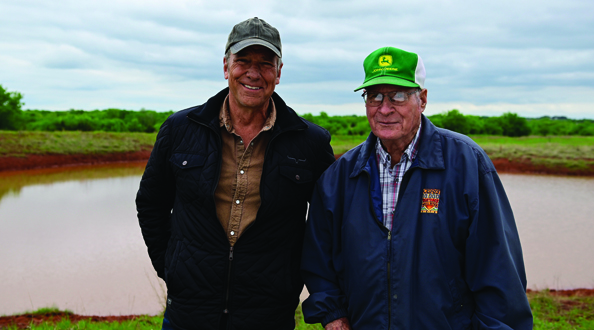 Mike Rowe with a farmer