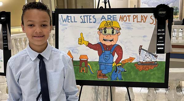 Well site safety winner student with "Well sites are not play sites." entry