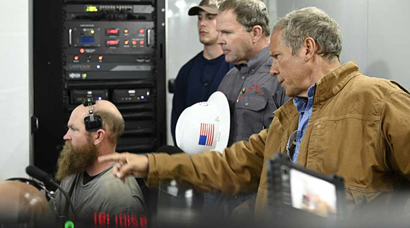 Mike Rowe with operations technicians