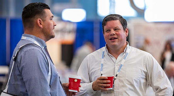 Two attendees talking